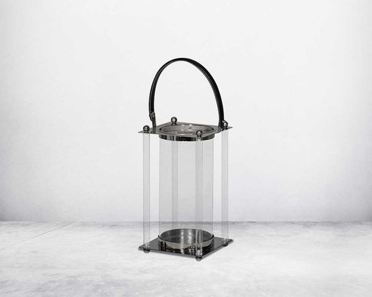 This lantern is crafted from leather, glass, and stainless steel and is perfect for adding aesthetic warmth and conviviality in any nighttime outdoor space. large