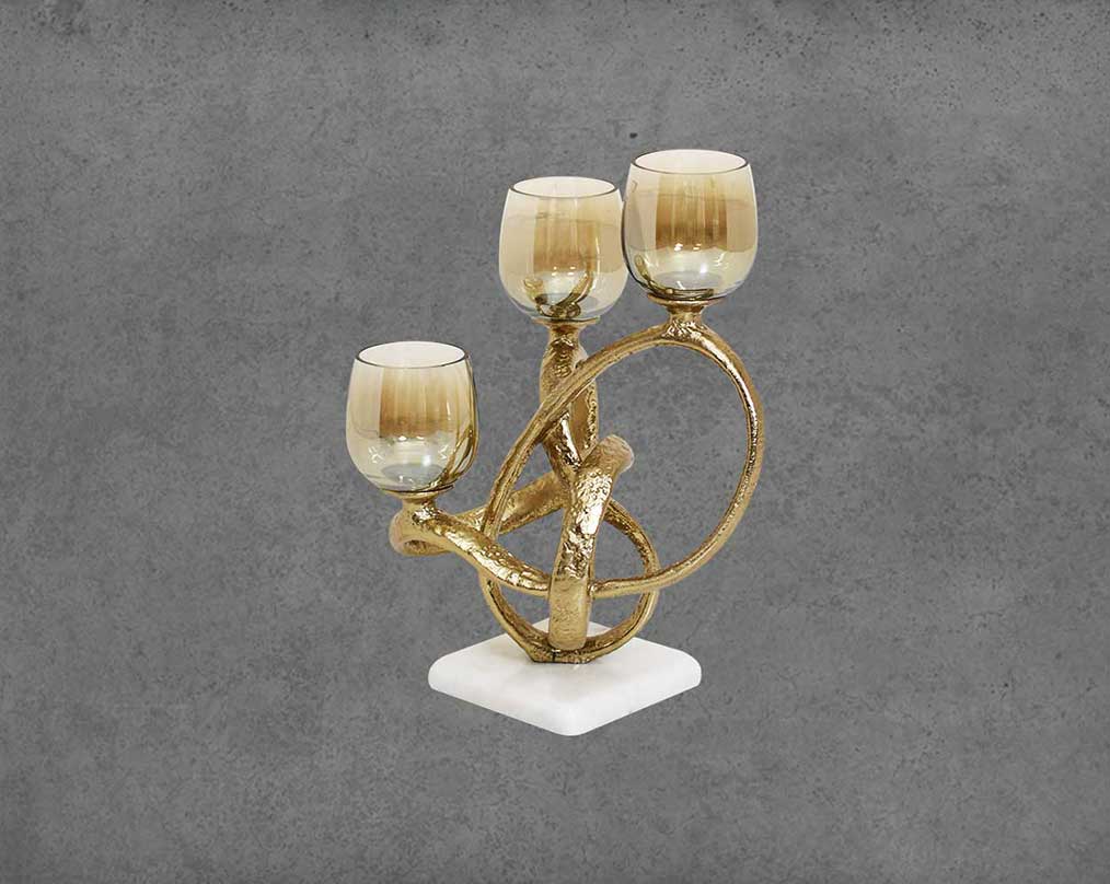 Multi T-light candle holder in gold-finished nickel plated aluminum, smoke luster glass with white marble base.