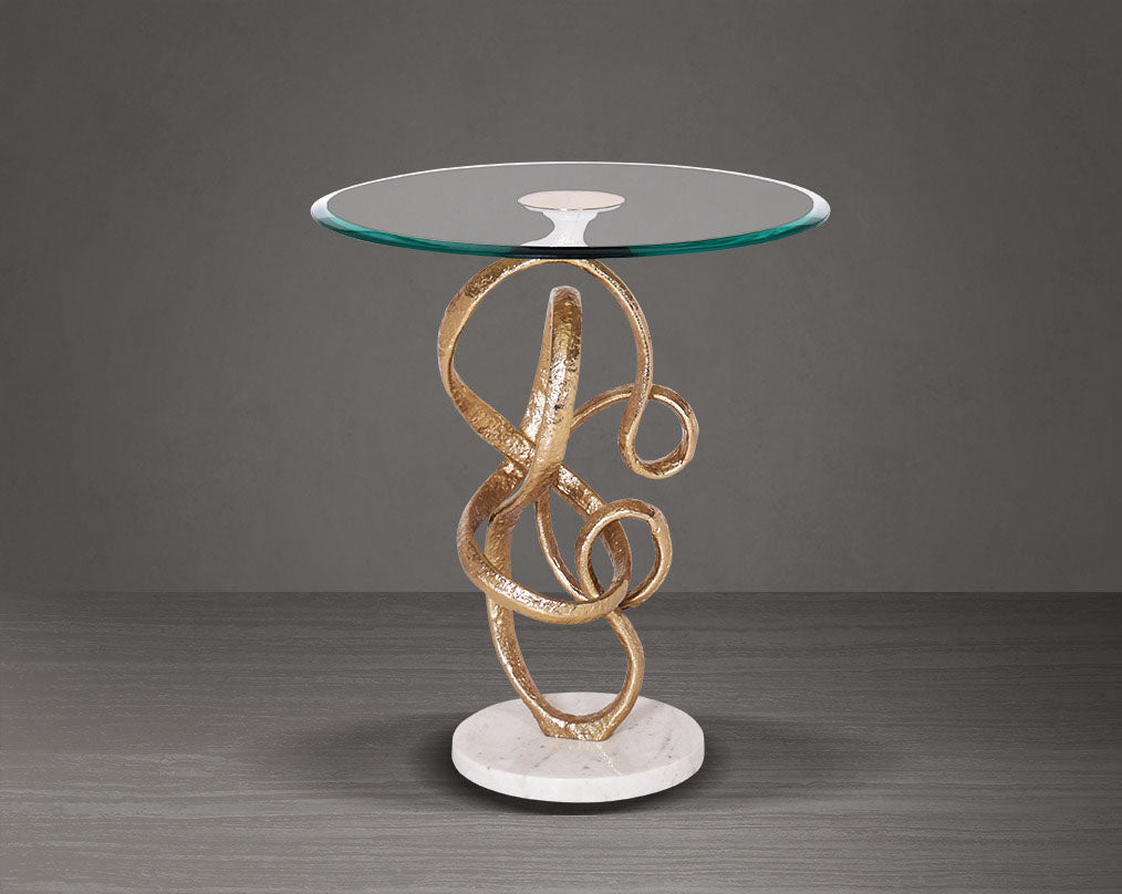 This artful gold accent end table glass top with an amorphously shaped high polished gold pedestal & white marble base.