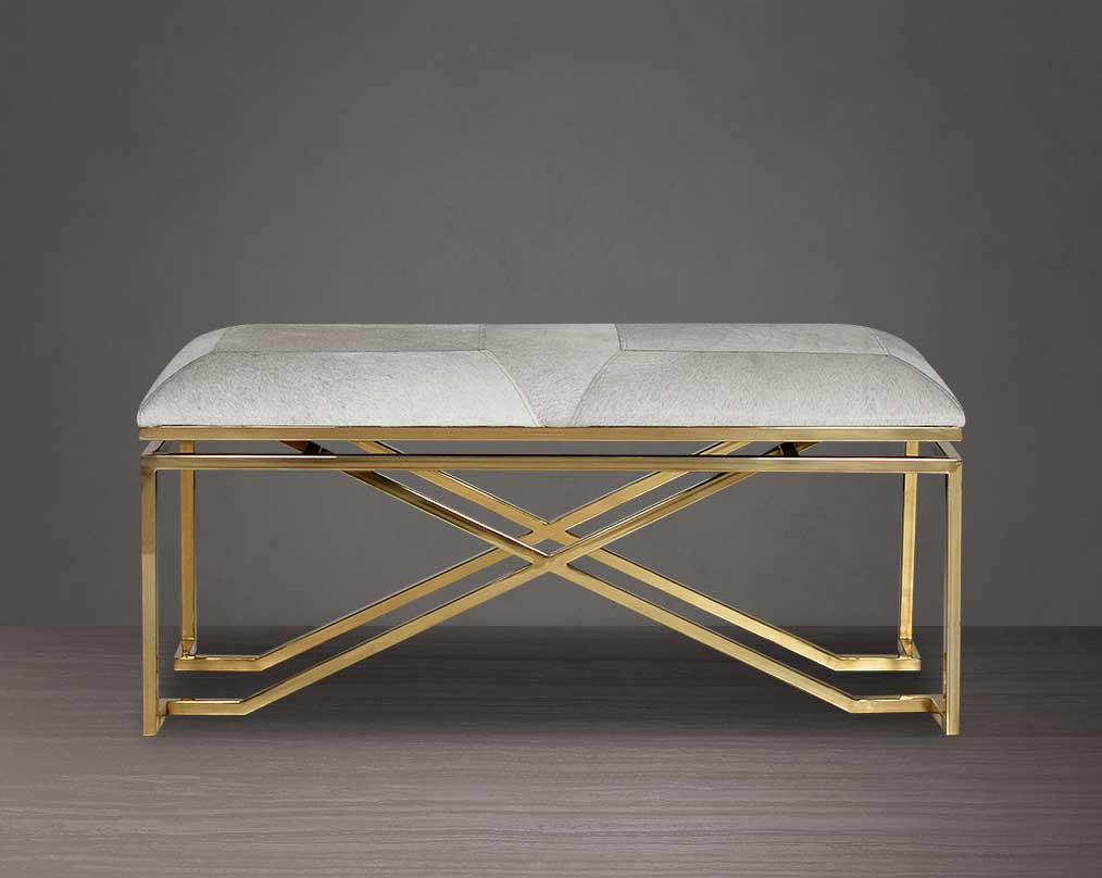 Double bench upholstered in light grey hide seat and high polished gold stainless steel legs in a contemporary, cross design.