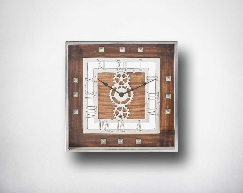 Square wall clock in aluminium and wood in natural finish with roman numerals.