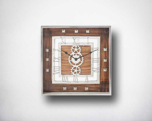 Square wall clock in aluminium and wood in natural finish with roman numerals.