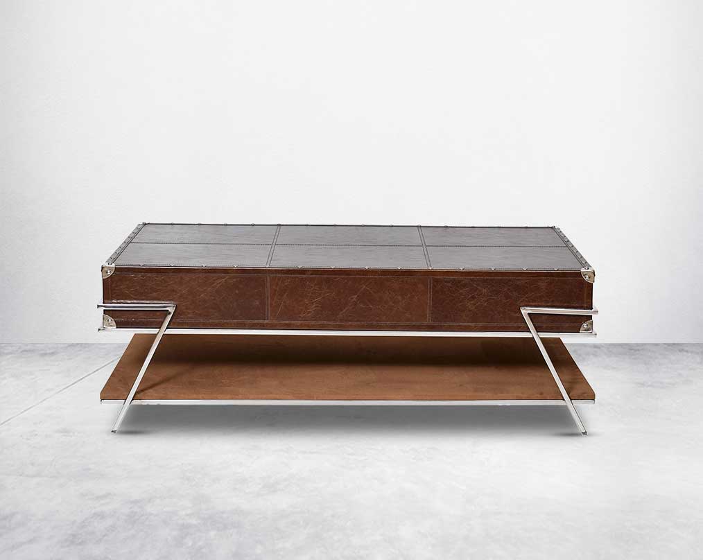 The table has 2 drawers with stainless steel legs. End table in vintage brown luxurious leather and stainless steel rivets with openable top and base in suede with stainless steel legs.