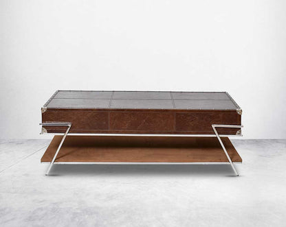 The table has 2 drawers with stainless steel legs. End table in vintage brown luxurious leather and stainless steel rivets with openable top and base in suede with stainless steel legs.