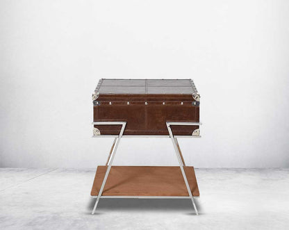 Coffee table with low height in vintage brown luxurious leather and stainless steel rivets top and base in suede.
