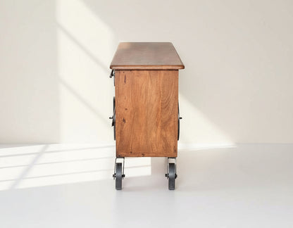 Wine cart/ bar with a vintage look in mango wood and powder-coated iron wheels with storage.
