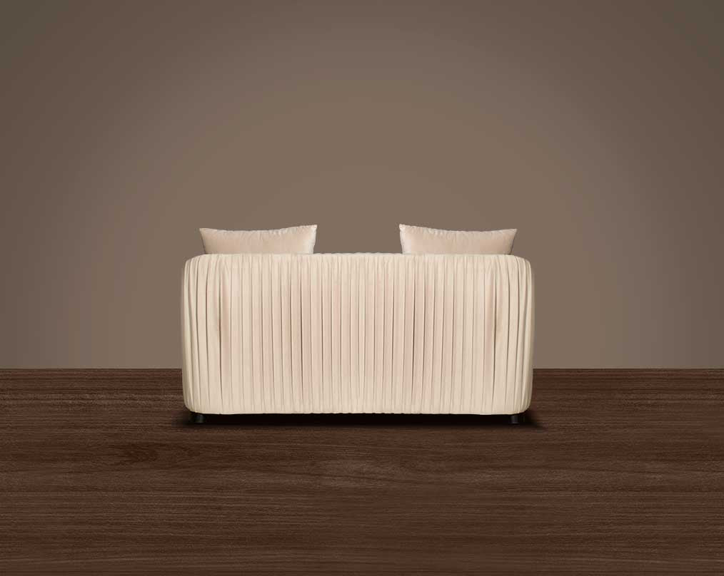 This 2 sofa back with is a sensory experience of luxurious relaxation and esoteric design. With a curvilinear silhouette, it features rich fabric upholstery on wooden frame conjuring the right sensations of comfort and inevitable luxury.