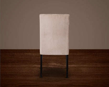 This quilted backrest dining chair back with in velvet fabric exudes timeless comfort and sophisticated beauty. The frame is constructed of solid wood to ensure lasting strength and stability. Perfect for a casual or formal dinner soirée.