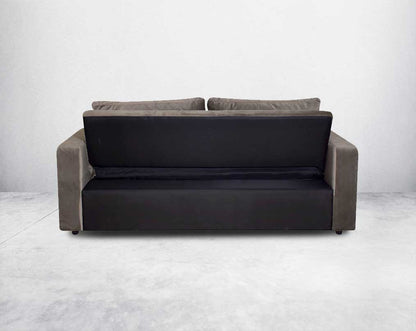Our stylish sofa cum bed that enhances the aesthetic appeal of your living space. Featuring wide arm rests with two glass holders and deep cushioned seat that offers maximum utility space. It comes upholstered in fabric with wooden legs. It features a fol