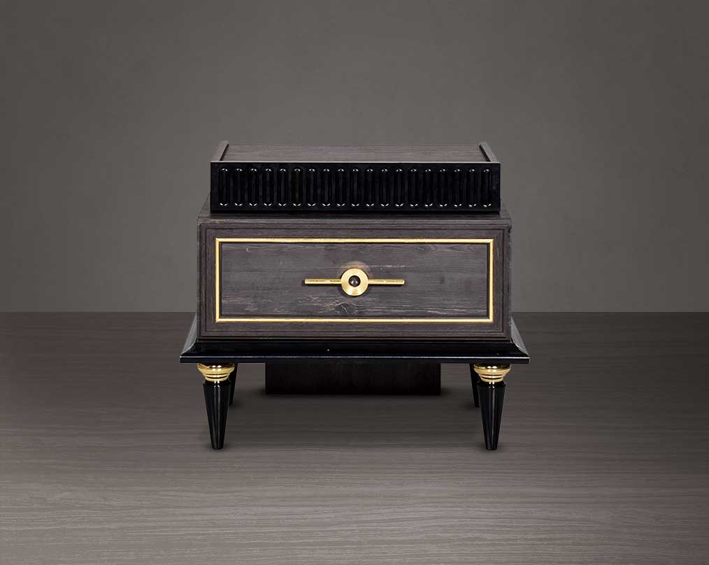Bedside closed drawer  table in dark oak finish with antique gold design motif and two drawers with golden handles in modern classic design.
