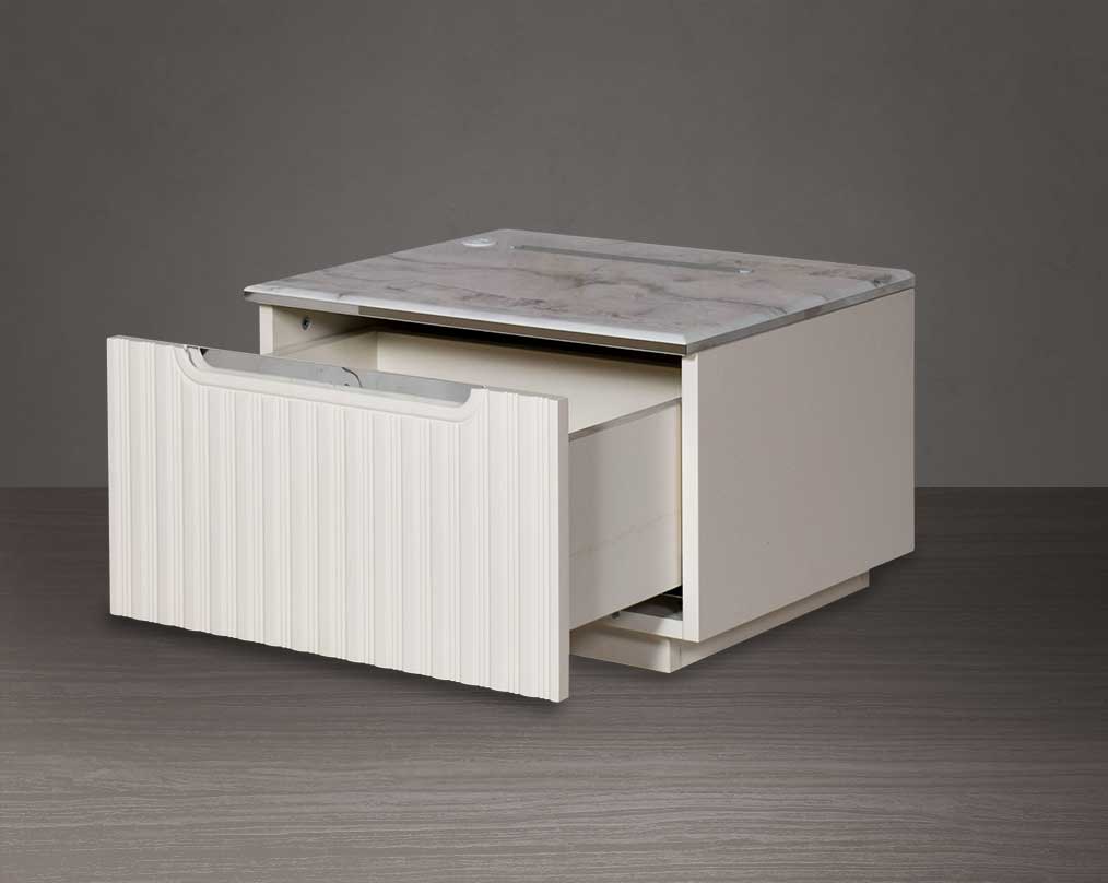 The bedside table comes with open drawer a marble finish top & lacquered in high gloss with a spacious drawer with a cream finish handle & base.