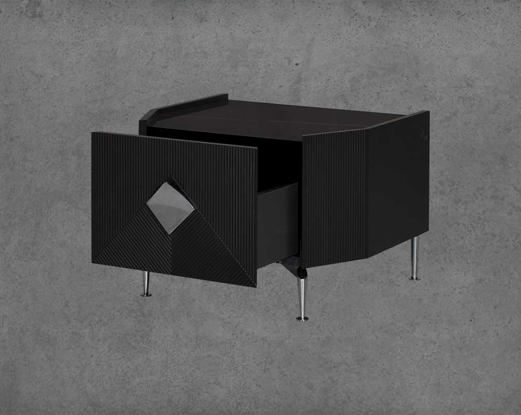 The gorgeous bedside table is in a black glossy finish with a spacious open  drawer with stainless steel handle & base.