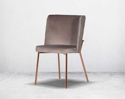 Minimalistically designed chair with criss-cross stitch padded fabric in rose gold finish stainless steel legs in contemporary design.