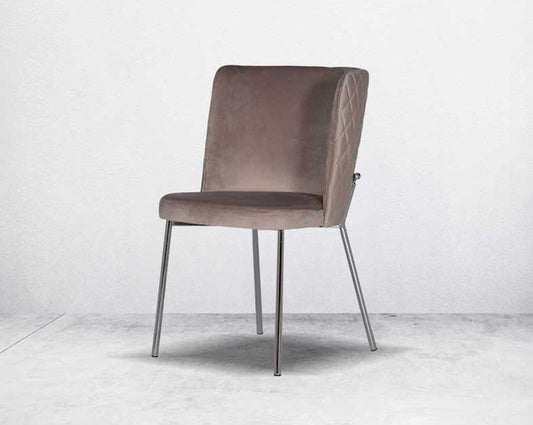 Minimalistically designed chair with criss-cross stitch padded fabric in silver finish stainless steel legs in contemporary design.