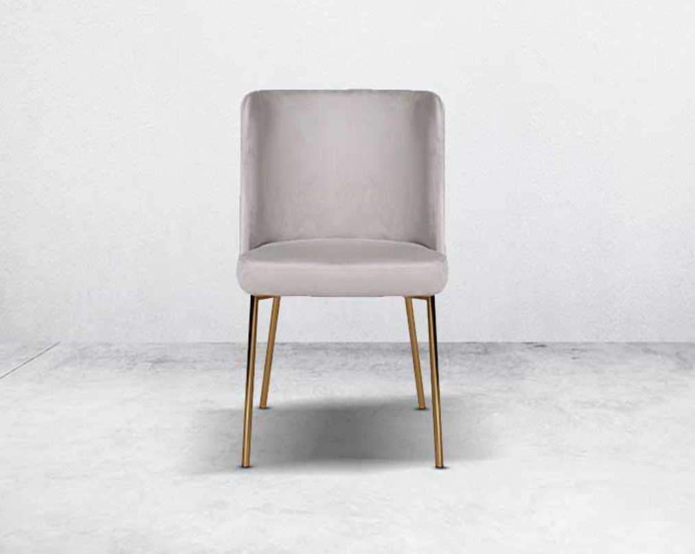 Minimalistically designed chair front  with criss-cross stitch padded fabric in gold finish stainless steel legs in contemporary design.