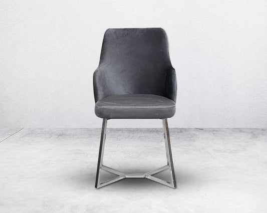 This soft, cushioned dining chair features an extraordinary contemporary design with a tufted back and cushioned seat with stainless steel legs front view