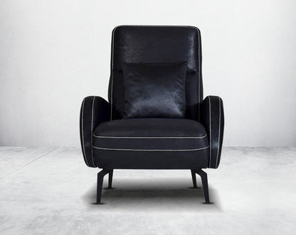 the armchair upholstered in fabric with stainless steel black plated legs in modern classic design.