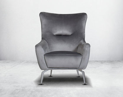 The backrest is reversible which creates more sitting space & can also be used as a sofa bed. The set comes with 1 cushions to compliment it. Beautifully crafted wing armchair upholstered in fabric with tufted back and high gloss stainless steel legs in m