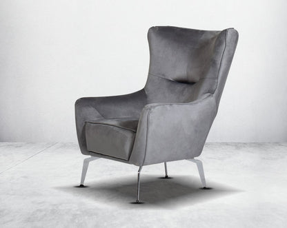 The backrest is reversible which creates more sitting space & can also be used as a sofa bed. The set comes with 1 cushions to compliment it. Beautifully crafted wing armchair upholstered in fabric with tufted back and high gloss stainless steel legs in m