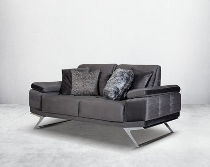The backrest is reversible which creates more sitting space & can also be used as a sofa bed. The set comes with 2 cushions to compliment it. Beautifully crafted wing armchair upholstered in fabric with tufted back and high gloss stainless steel legs in m
