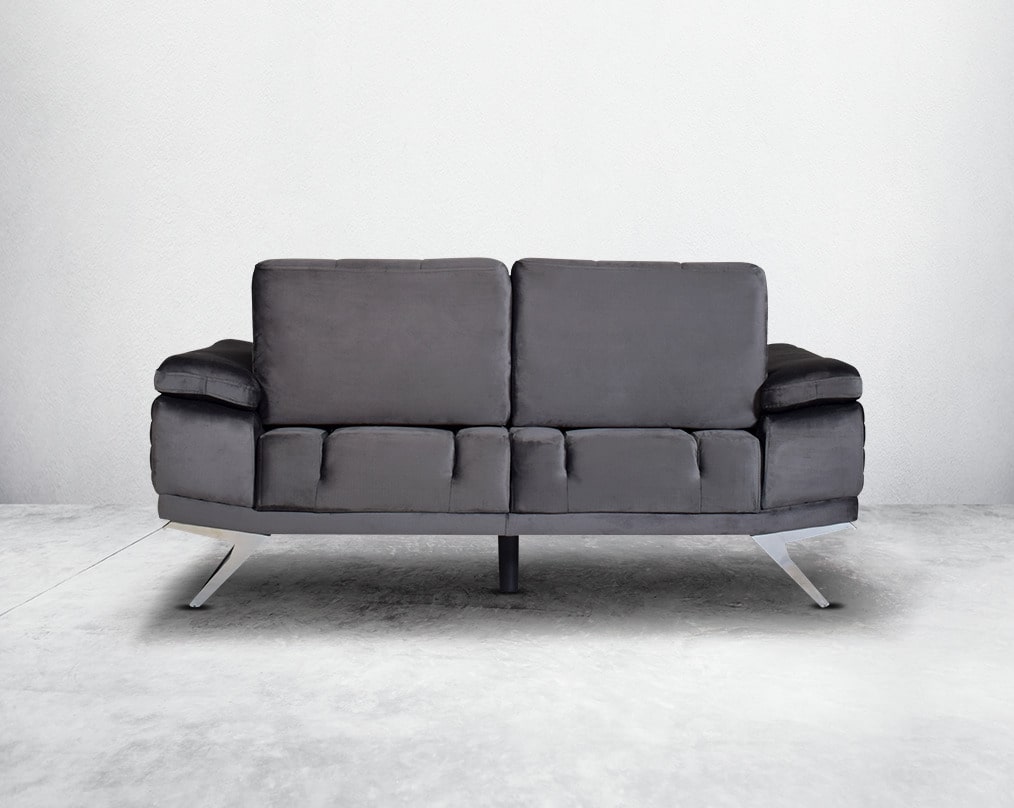 The backrest is reversible which creates more sitting space & can also be used as a sofa bed with back The set comes with  cushions to compliment it. Beautifully crafted wing armchair upholstered in fabric with tufted back and high gloss stainless steel l