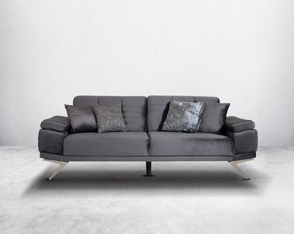 This elegant and sophisticated sofa upholstered in fabric with clean lines, straight shelter arms softened by subtle curves in modern classic design. Horizontal channel quilting is an outstanding design detailed with high gloss stainless steel base.