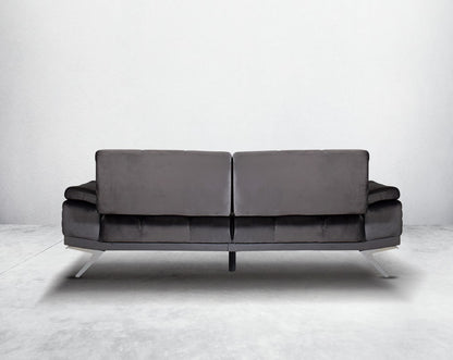 This elegant and sophisticated sofa upholstered in fabric with clean lines, back  shelter arms softened by subtle curves in modern classic design. Horizontal channel quilting is an outstanding design detailed with high gloss stainless steel base.