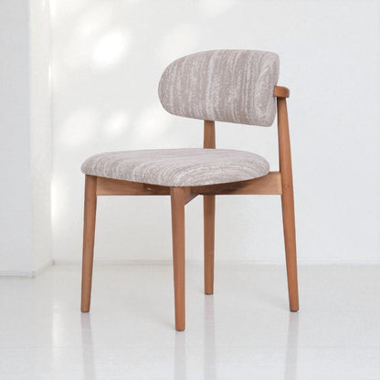 Chair with gray cushioned seat and backrest on a white background