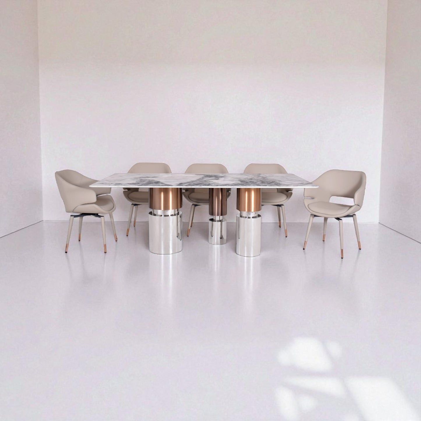 Modern dining table with marble top and metallic legs in a minimalistic setting