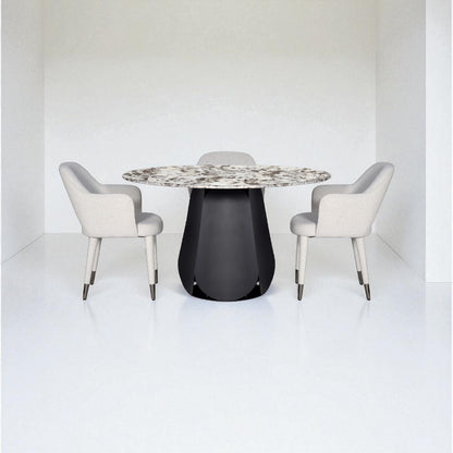 Dining table with a patterned top and black base, surrounded by four chairs on a white background