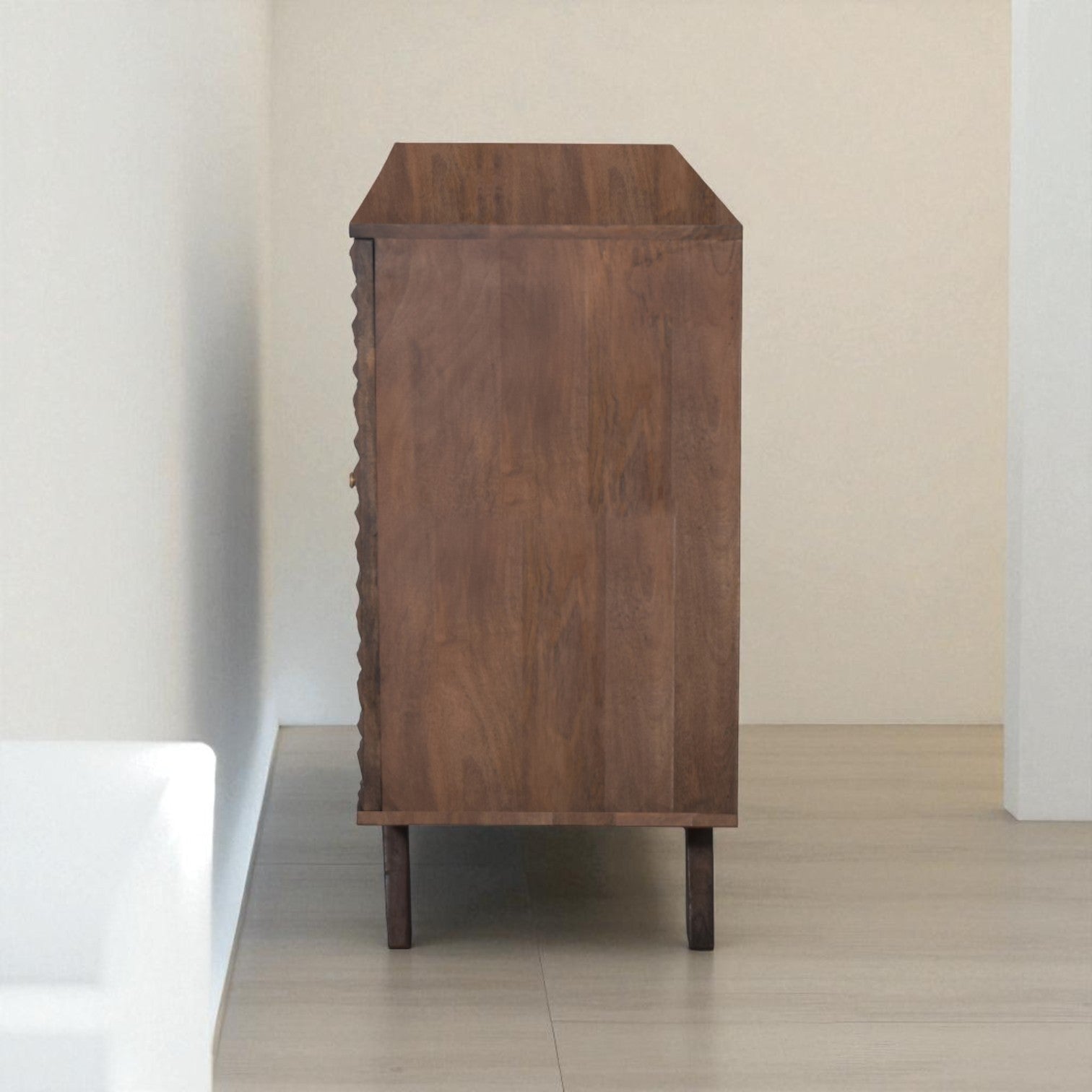 Wooden side table against a plain wall