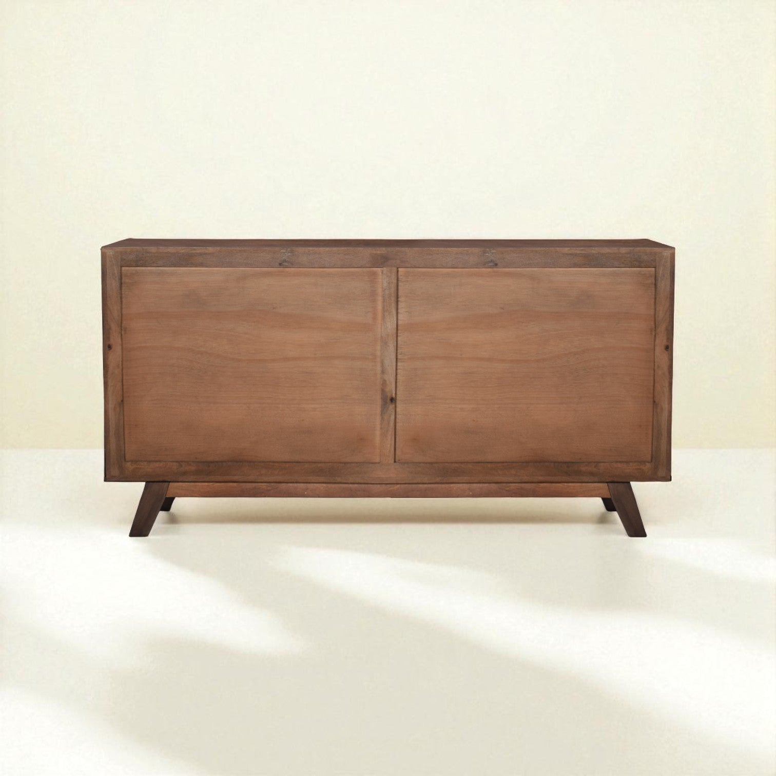 Wooden sideboard with two doors on a white background