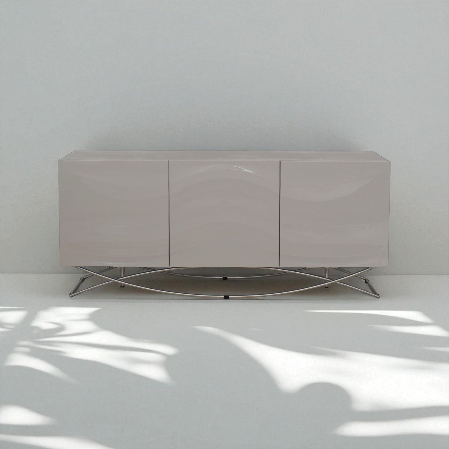 Modern sideboard with a metallic base against a white wall