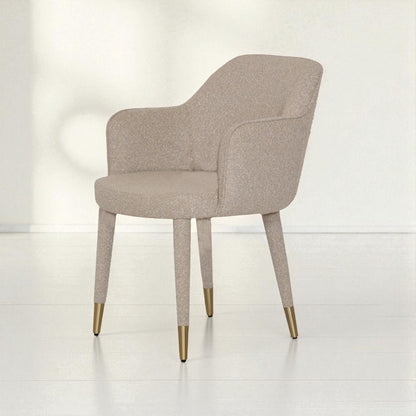 Beige chair with gold legs on a white background