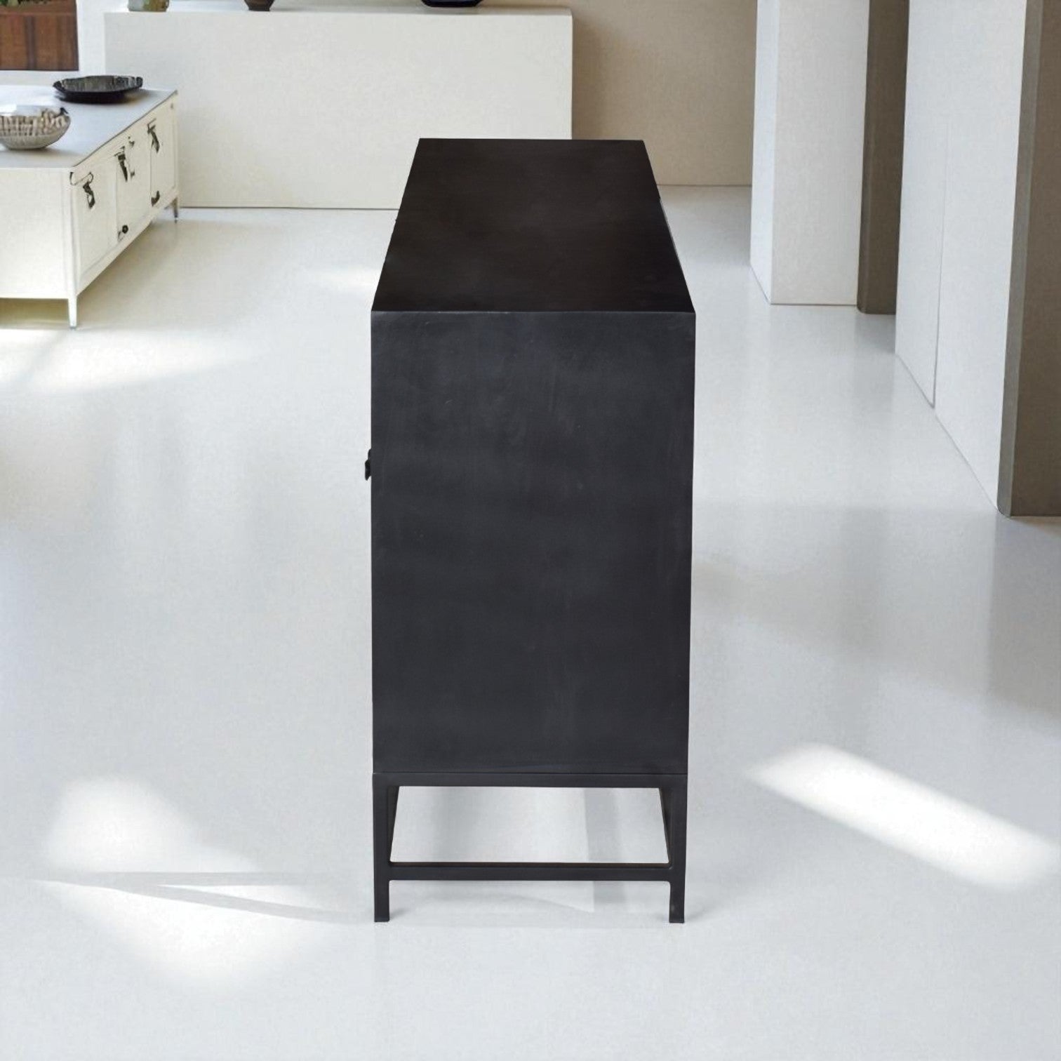 Black rectangular object on a white floor