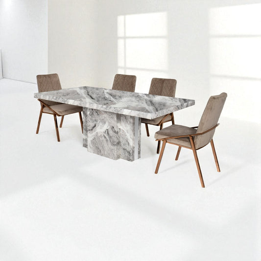 Dining table with marble-like surface and four chairs in a bright room