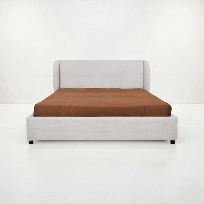 Bed with brown mattress and white frame on a white background