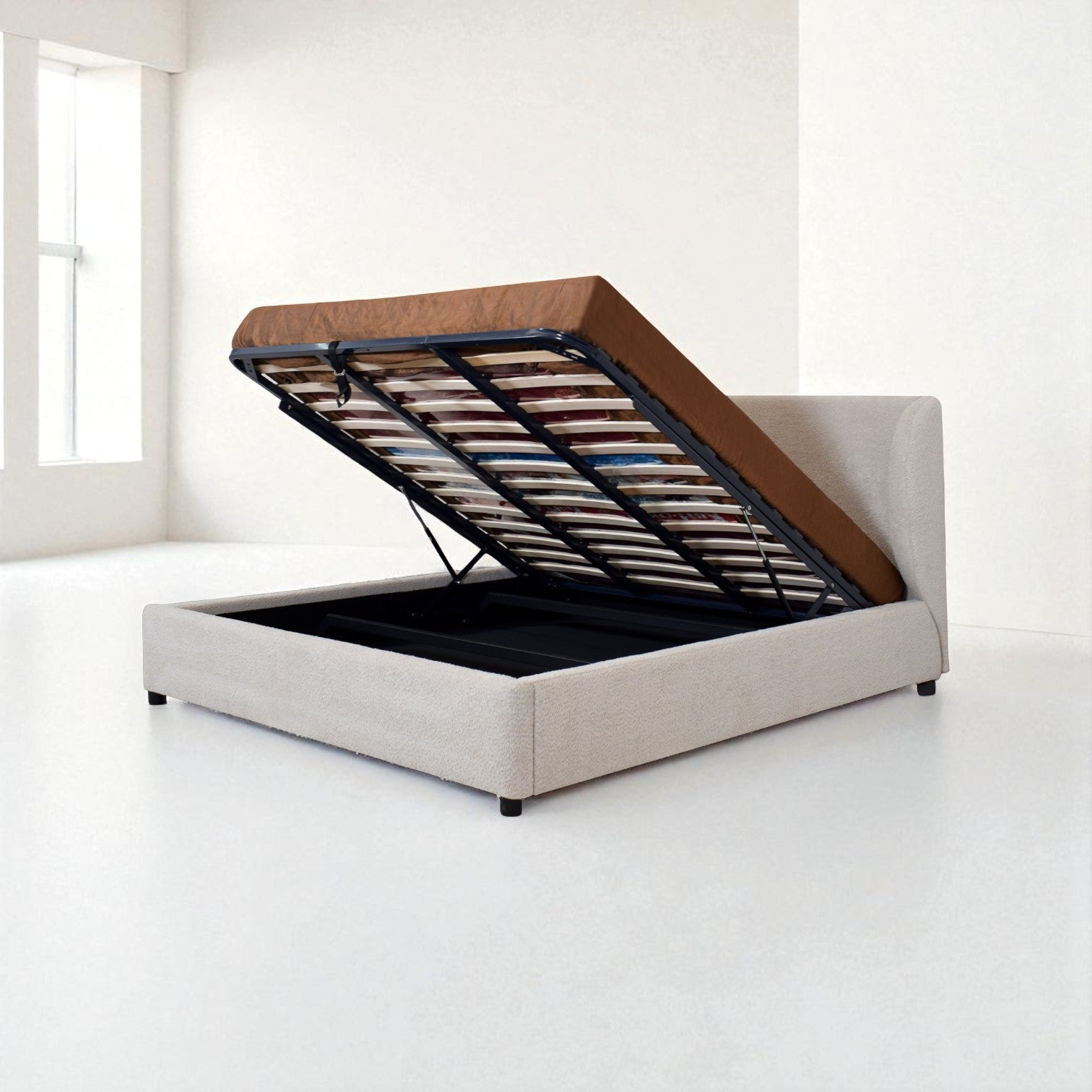 Beige upholstered bed with storage compartment in a minimalistic room.