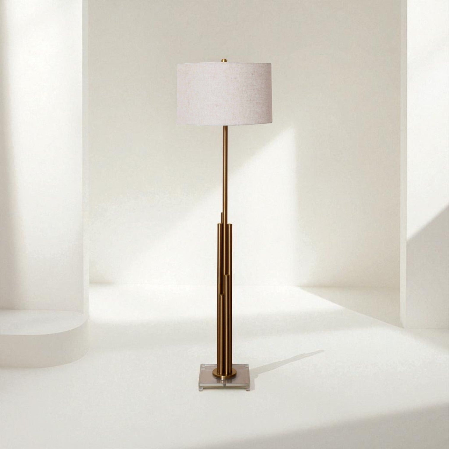 Floor lamp with a white shade and bronze base on a white background