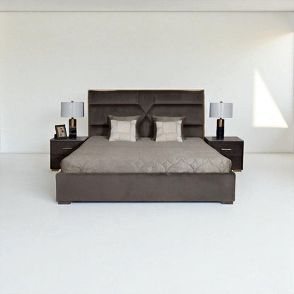 Modern bedroom setup with a bed, nightstands, and lamps against a white wall.