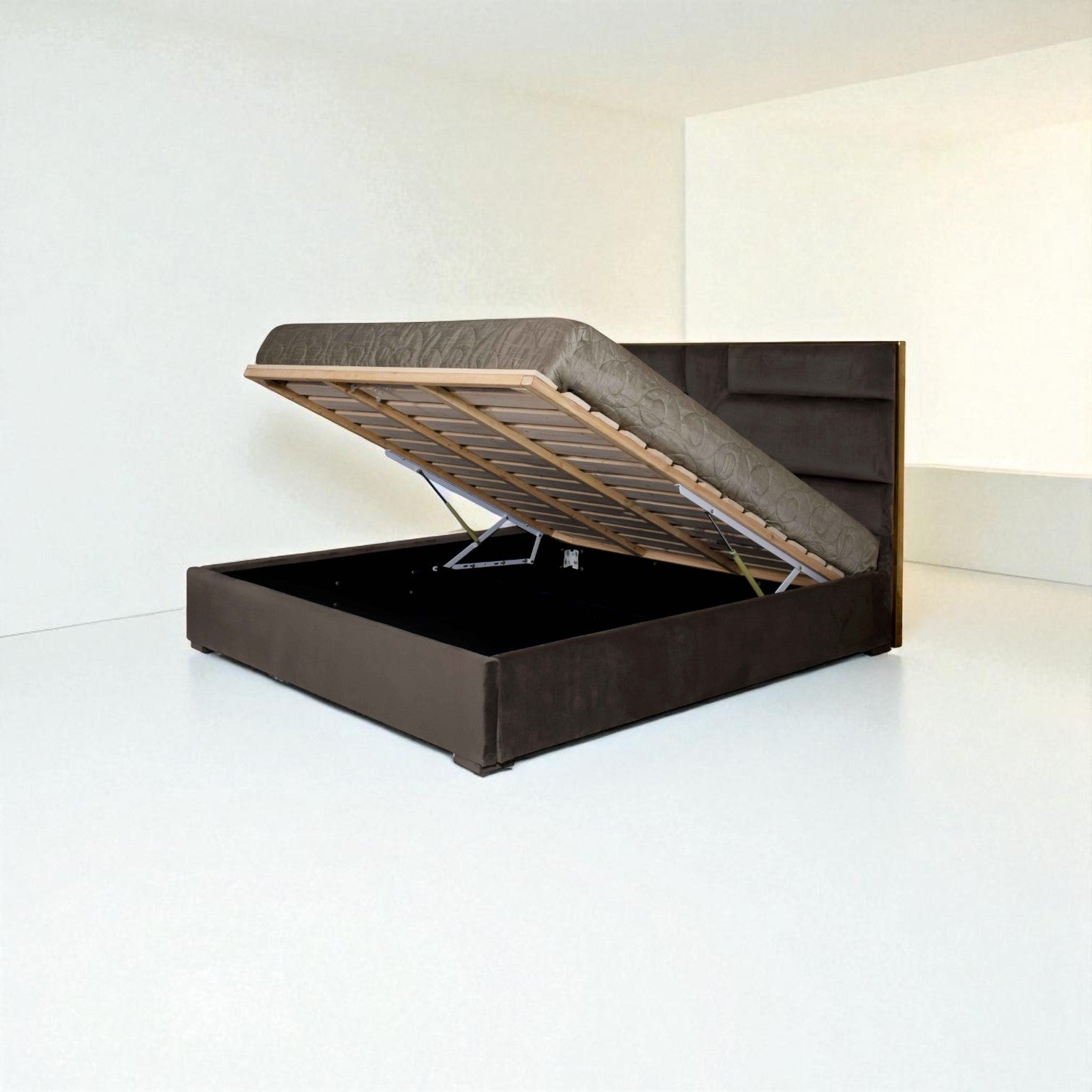 Brown upholstered bed frame with open storage compartment on a white background