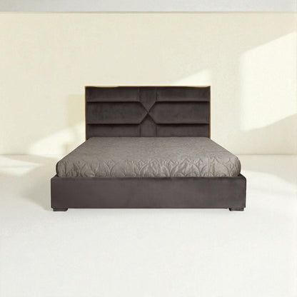 Gray bed with quilted design on a white background