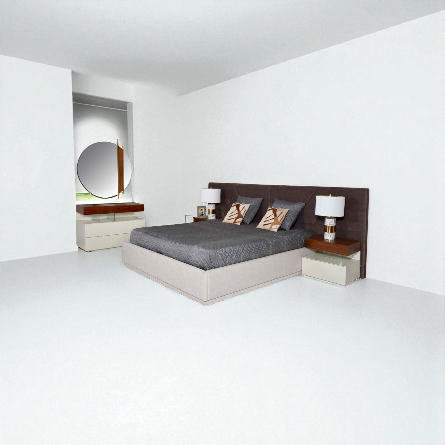 Modern bedroom with a beige bed, dark upholstered headboard, geometric pillows, white nightstands, silver lamps, and a round mirror above a dresser in a bright minimalist space.