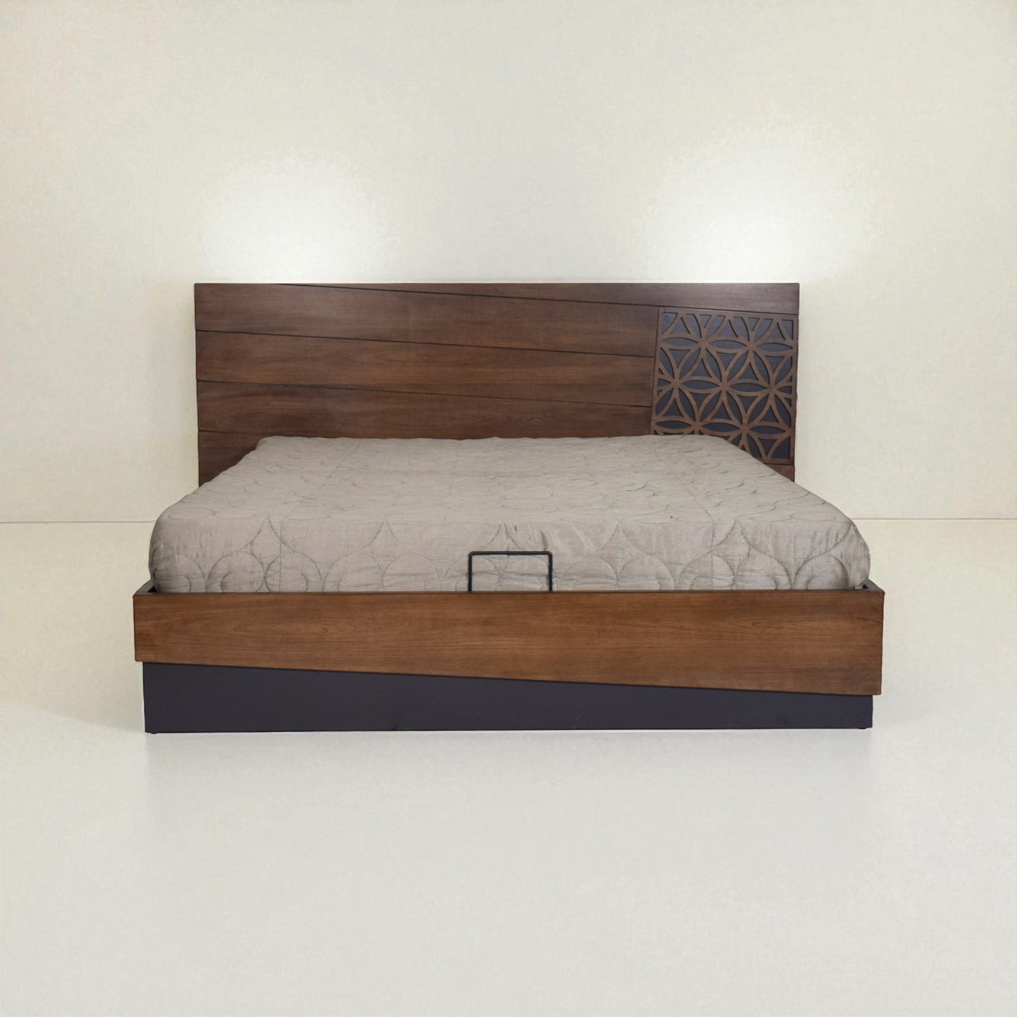 Wooden bed with a patterned headboard and light mattress, shown from the front in a minimal white room.