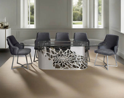 This exquisite & beautiful dining table with an artistic laser cut base in glossy stainless steel this soft, cushioned dining chair features an extraordinary contemporary design with tufted back and cushioned seat with stainless steel legs