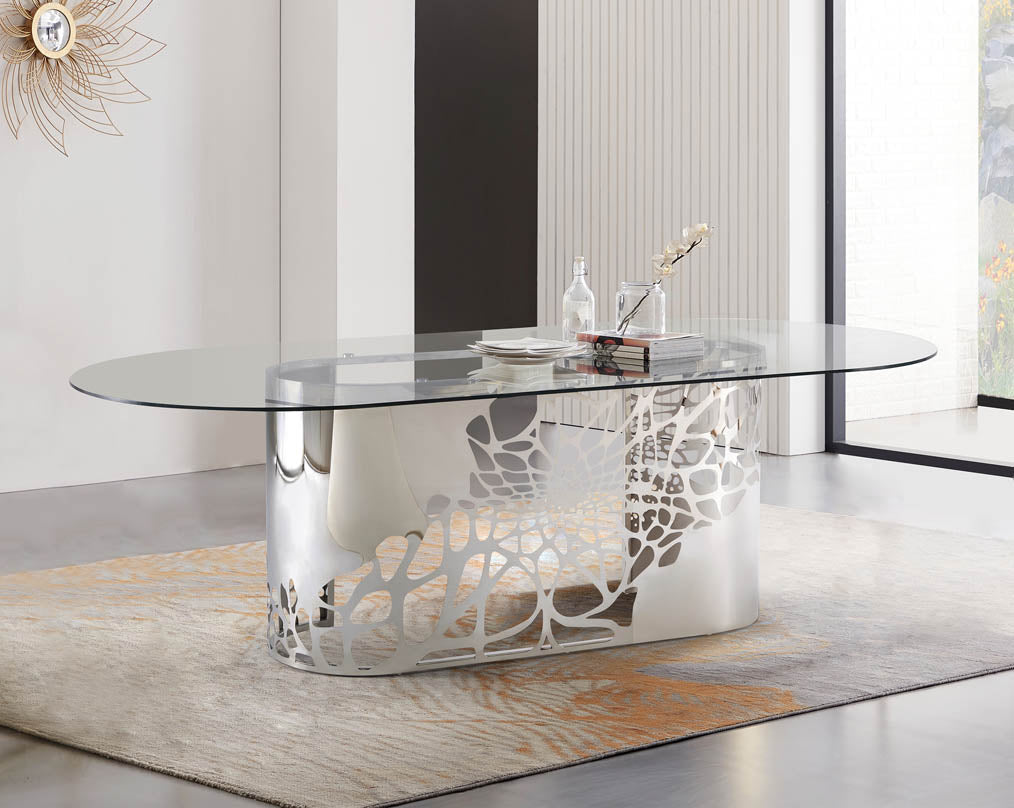 This exquisite & beautiful dining table with an artistic laser cut base in glossy stainless steel base with clear bevelled tempered glass top in a sumptuous style with book 
