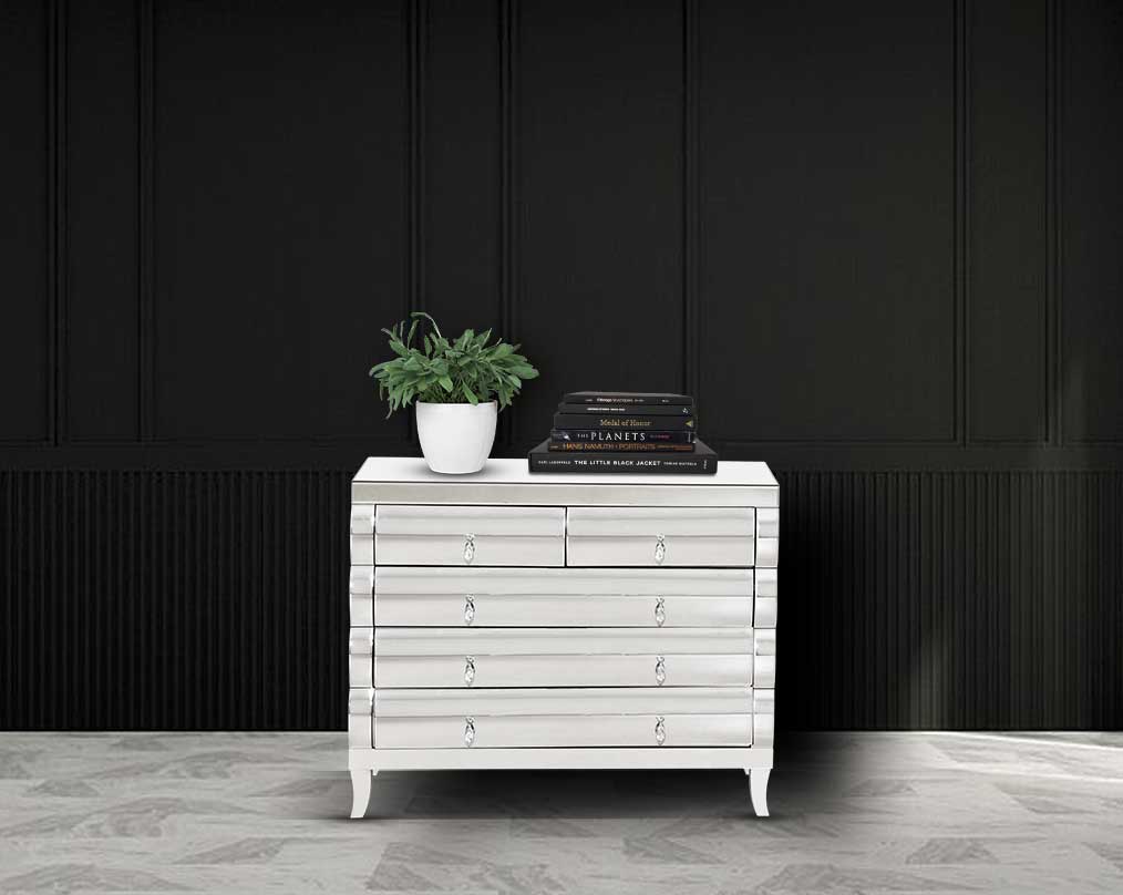 The table has one drawer with rectangular steel frame in rich contemporary design closed drawer with green plant 