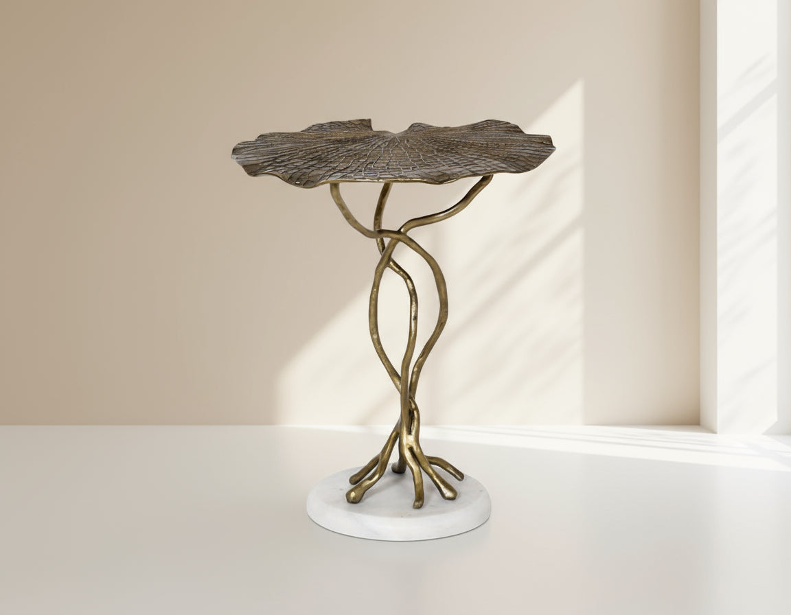 End table with leaf motif in an antique gold-finished aluminum with marble base.
