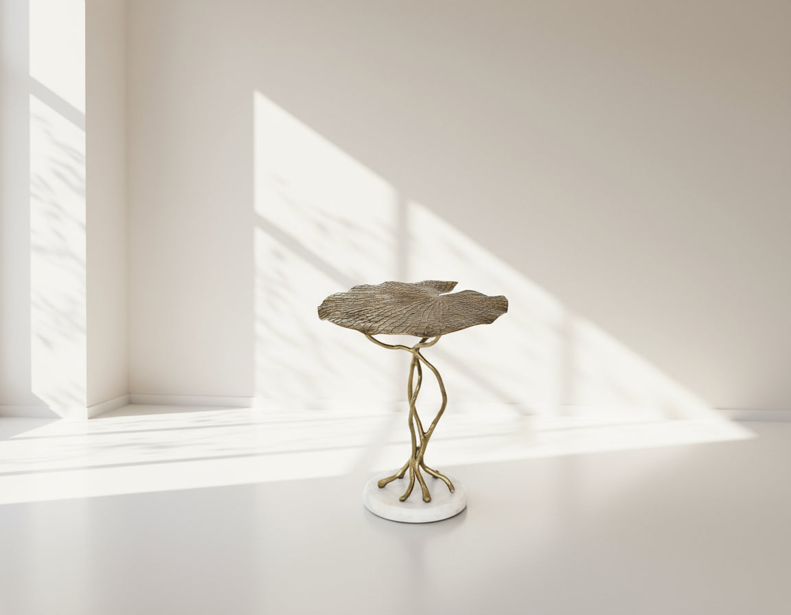 End table with leaf motif in an antique gold-finished aluminum with marble base top view