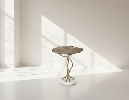 End table with leaf motif in an antique gold-finished aluminum with marble base top view